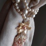 Pink tieback pearls and flowers