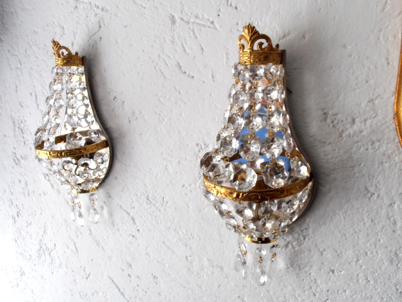Empire style gilded sconces with crystals