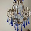ornate brass chandelier blue Murano drops